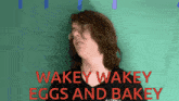 a man wearing glasses says wakey wakey eggs and bakey in red letters