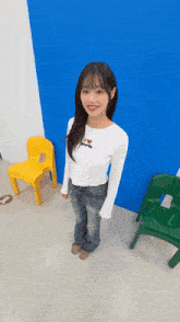 a young girl wearing a white shirt that says i love girls