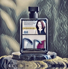 a perfume bottle with a picture of a woman on it