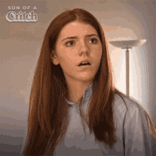 a woman 's face is shown in an ad for son of a glitch