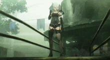 a woman in a black outfit is standing on a railing holding a gun