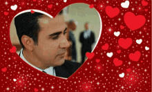 a man in a suit and tie is in a heart shaped frame