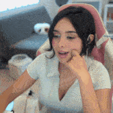 a woman is sitting in a chair with a watermark that says ' imgersl ' on it