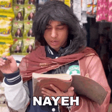 a man in a wig is holding a book with the word nayeh on it