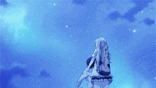 a man and a woman are looking at the stars in a blue sky