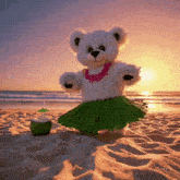 a teddy bear wearing a hula skirt is standing on the beach