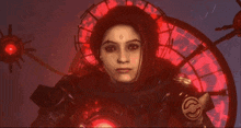 a woman with a cross on her forehead is standing in front of a red circle