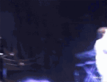 a blurry image of a person in a white suit with the words nbc gif at the bottom right
