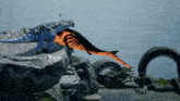 a dolphin is jumping out of the water next to a dinosaur