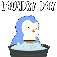 a blue and white penguin is sitting in a laundry basket
