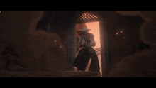 a man in a cowboy hat is holding a gun in a dark room