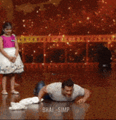 a man is crawling on the floor with the caption " bhai simp " below him