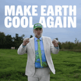 a man in a suit and tie is standing in a field with the words make earth cool again behind him