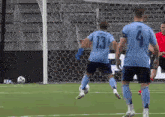 a soccer player wearing a number 13 jersey kicks the ball