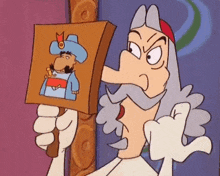 a cartoon character is holding a picture of a man with a beard and hat .