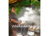 a picture of a man cooking with the words whahaha behind him