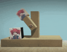 a piece of cardboard with a girl on it