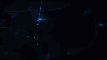 a blue light is shining on a dark blue background