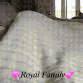 a bed with a blanket and the words royal family on it
