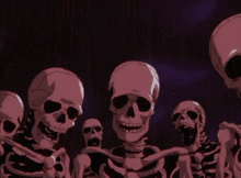 a group of skeletons standing next to each other in a dark room