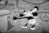 a black and white cartoon of mickey mouse driving a ship