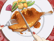 a plate of food with a knife and fork being used to cut a piece of meat