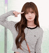 a girl wearing a striped shirt with the word escape all rights reserved on it