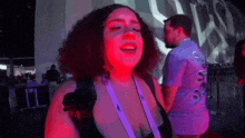 a woman with a lanyard around her neck that says ' sdf '