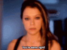 a blurry picture of a woman with the words you 're damn right