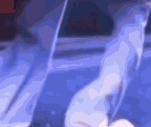 a blurred image of a person 's legs in a blue light