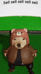 a cartoon character wearing a teddy bear hat and jacket is standing on a green surface .