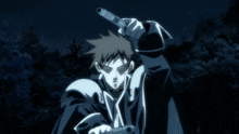 a man is holding a light in his hand while standing in the dark
