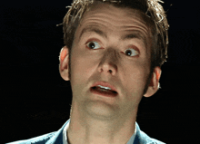 a close up of a man making a funny face