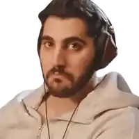 a man with a beard wearing headphones and a white hoodie