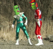 a green ranger and a red ranger are standing next to each other on the ground