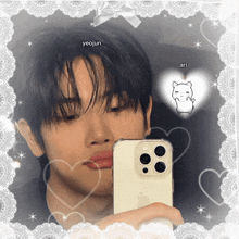 a young man taking a picture of himself in a mirror with the name yeojun written on the bottom
