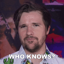 a man with a beard says " who knows "