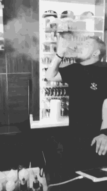 a man in a black shirt with a sticker on the front that says ' i love you ' on it