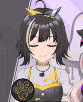 a close up of a girl 's face with her eyes closed and a circle with the letters q and o on it
