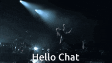 a woman is dancing on a stage with the words hello chat below her