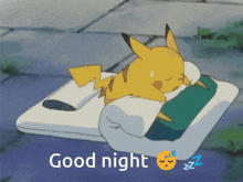 a pikachu is sleeping on a bed with the words good night written below it