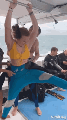 Wetsuits Large Wet Suit GIF - Wetsuits Large Wet Suit Fitting GIFs