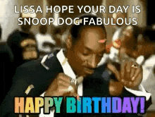 a man in a suit and tie is writing on a piece of paper and says `` lissa hope your day is snoop dog fabulous ``