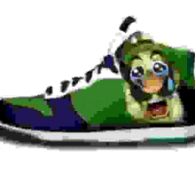 a green shoe with a cartoon character on it .