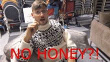 a man wearing a sweater with the word no honey written on it