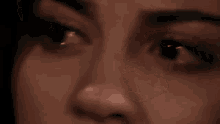 a close up of a woman 's face making a funny face .