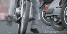 a close up of a person riding a motorcycle on a street .