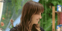 a close up of a woman 's face with the words gigigx at the top