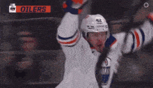 a hockey player with the number 42 on his jersey is celebrating