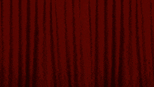 a cartoon character is standing on a stage with a red curtain behind him
